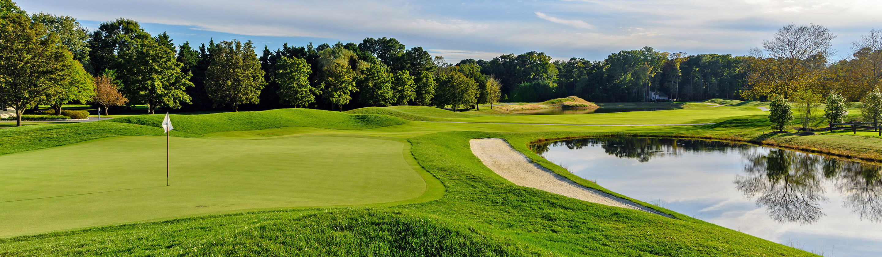 golf green by waterway