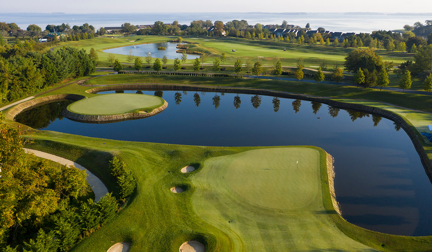 Golf green peninsula extending into water